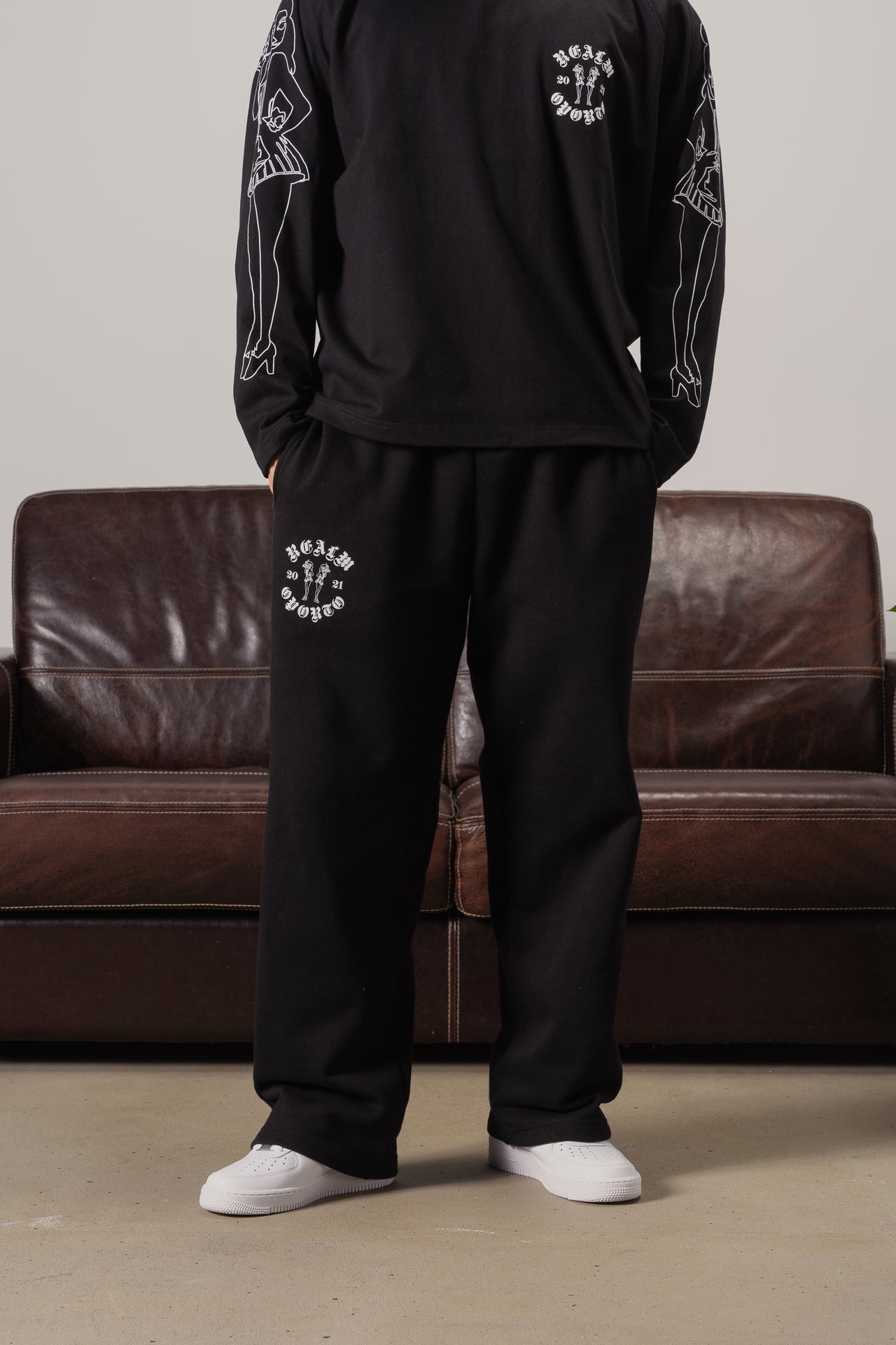 Realm Logo Black Sweatpants for Men & Women | Loose Fit